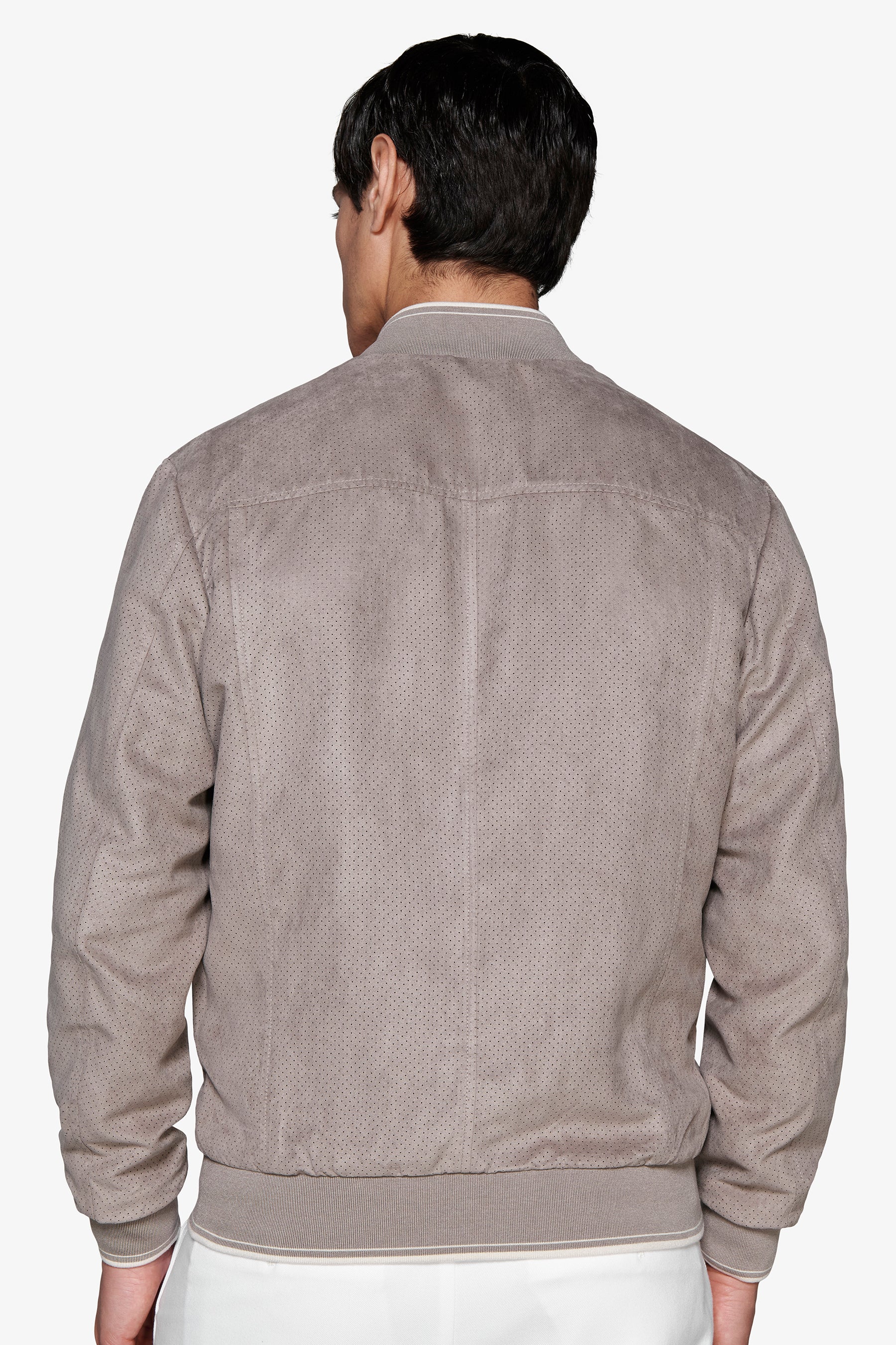 Bomberjacke aus perforiertem Öko-Wildleder in Taupe.