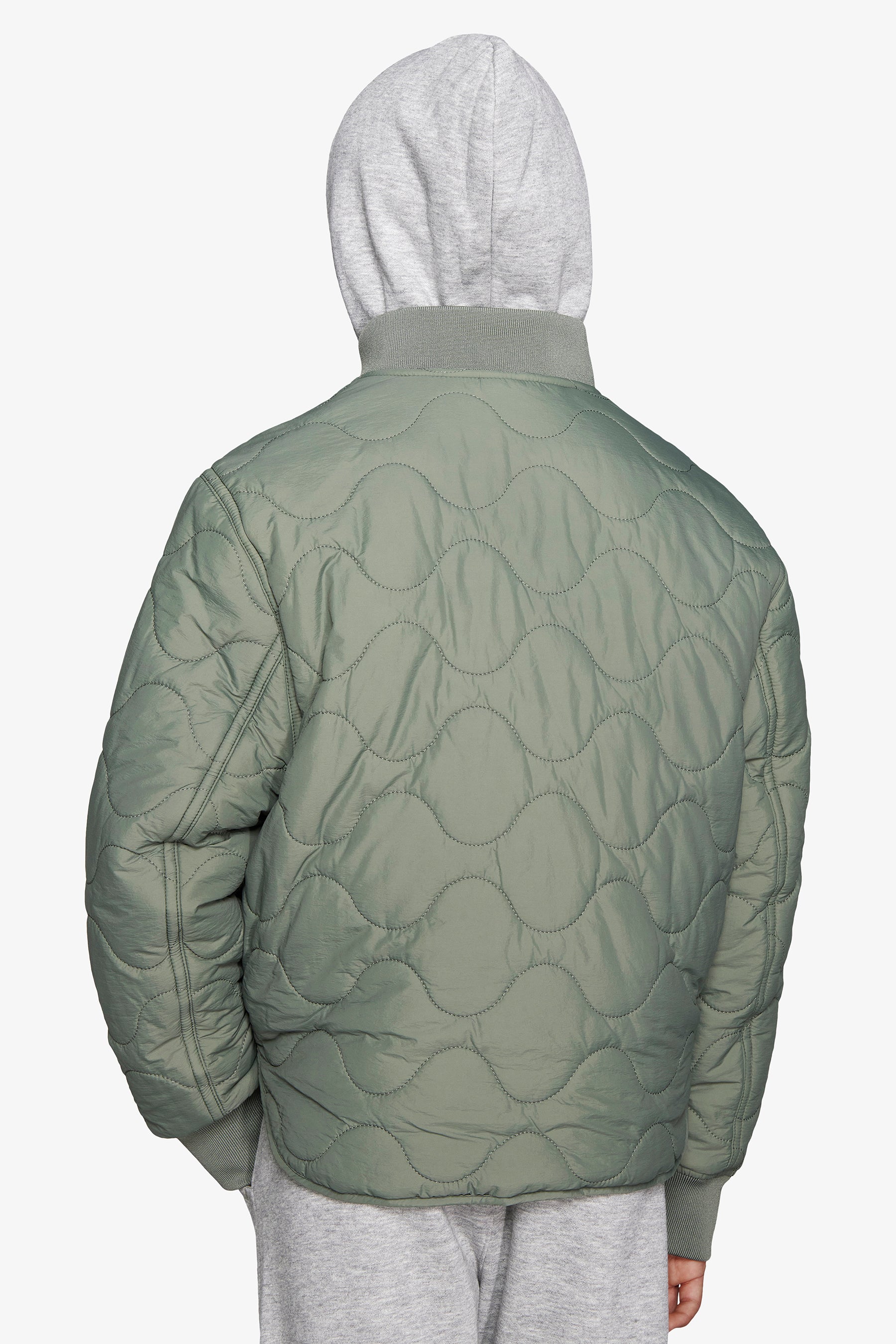 KIDS Green bomber jacket with horizontal wave quilting