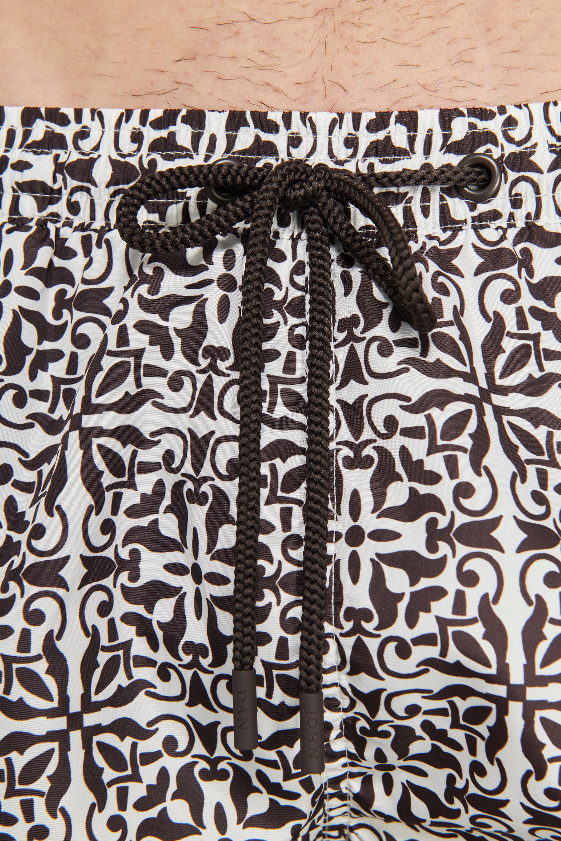 Dark brown ethnic print swim trunks