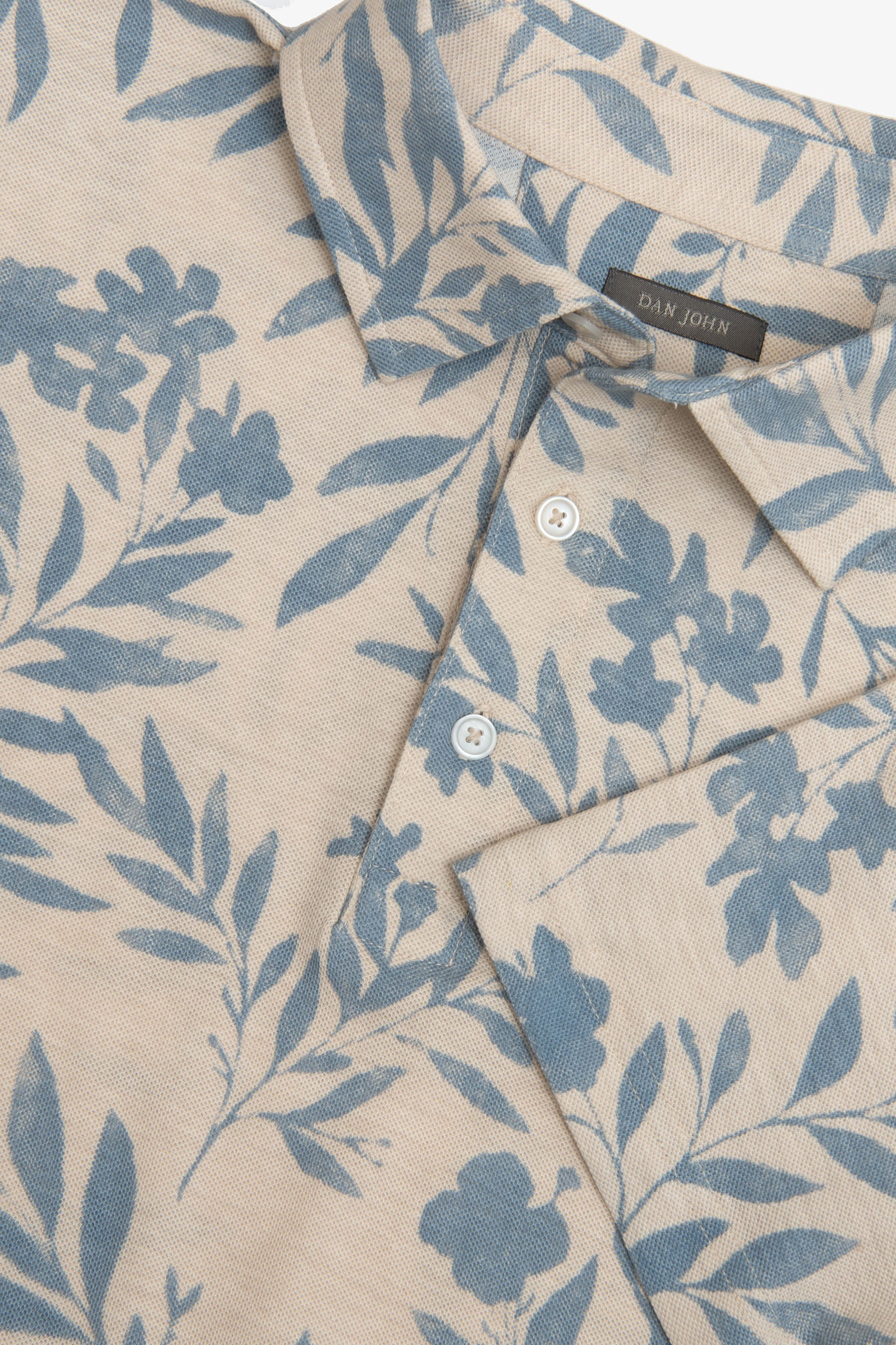 Polo in piquet fantasia fiore celeste-Dan John