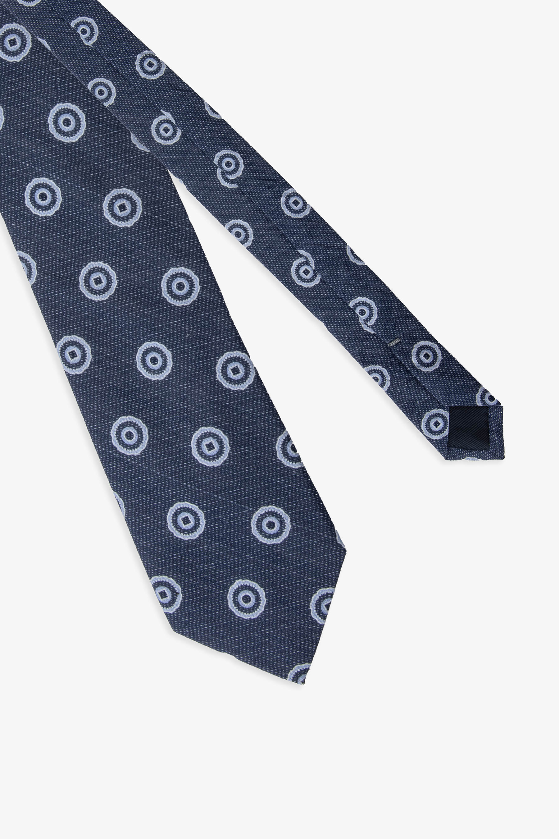 Corbata herringbone con estampado de círculos azul azafata