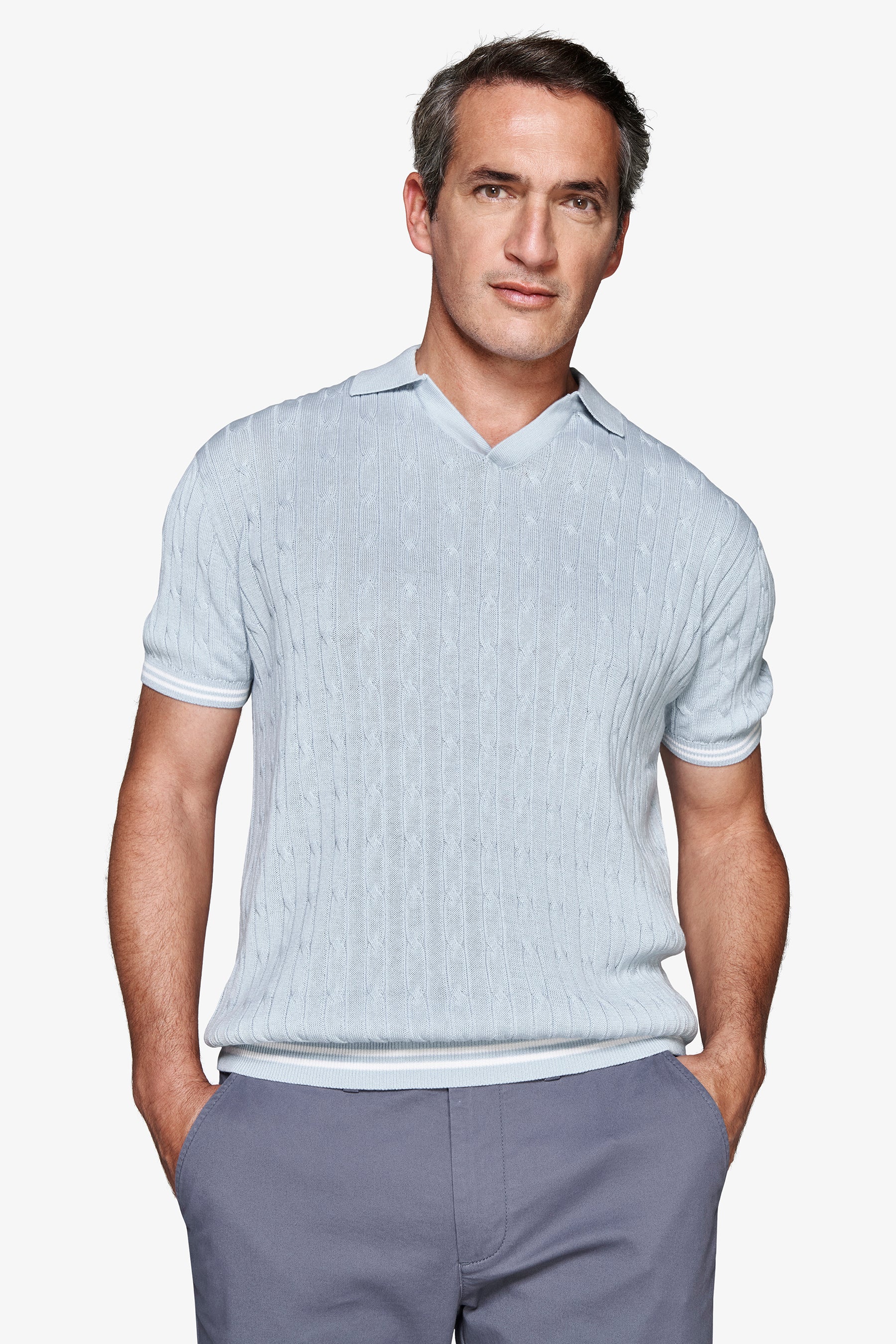 Polo in maglia treccia celeste