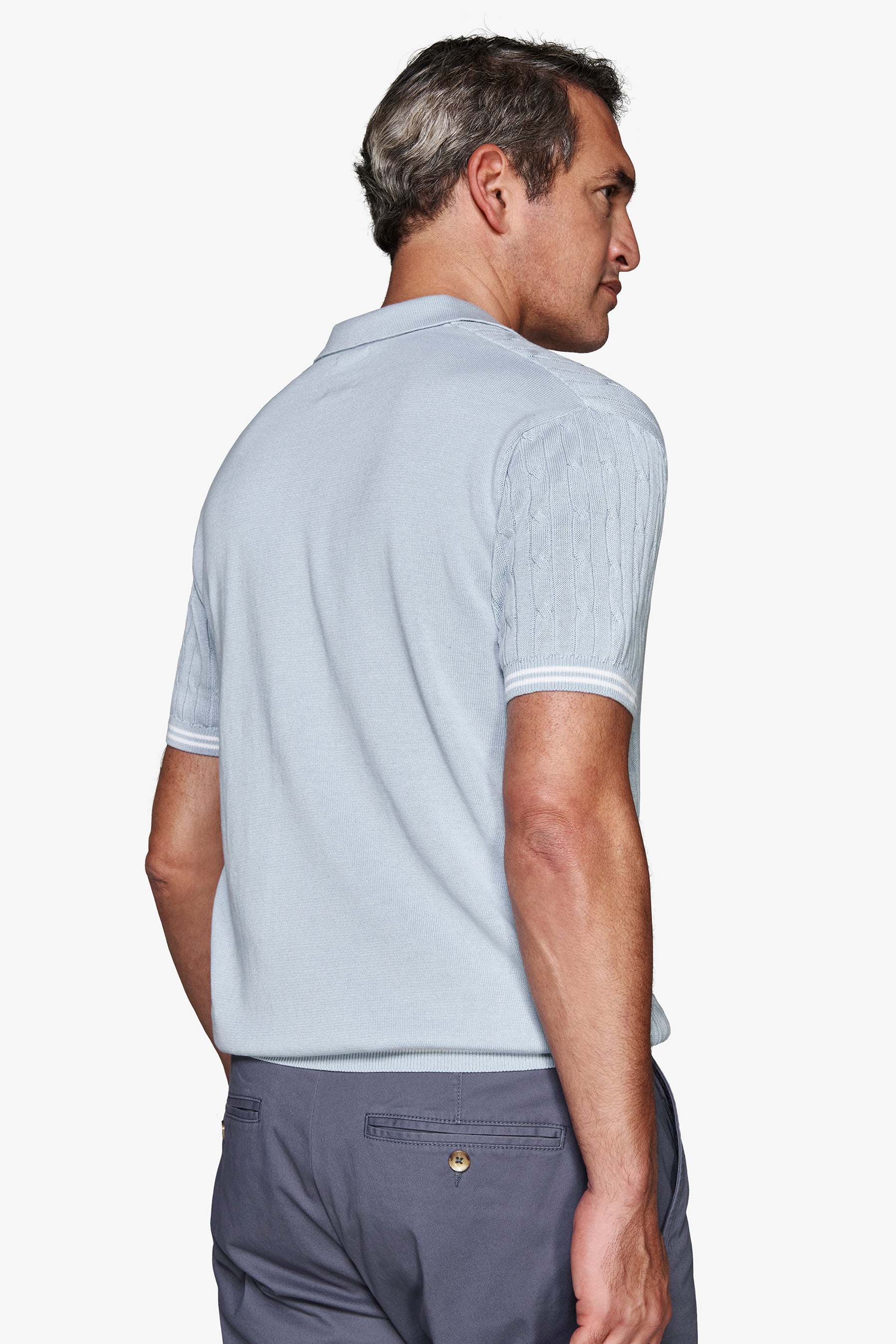 Polo in maglia treccia celeste