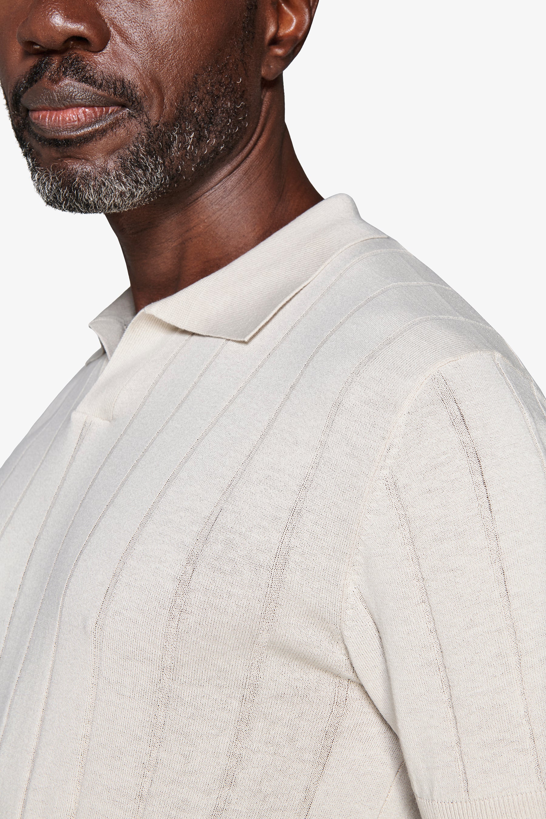 Polo in maglia costa piatta sabbia