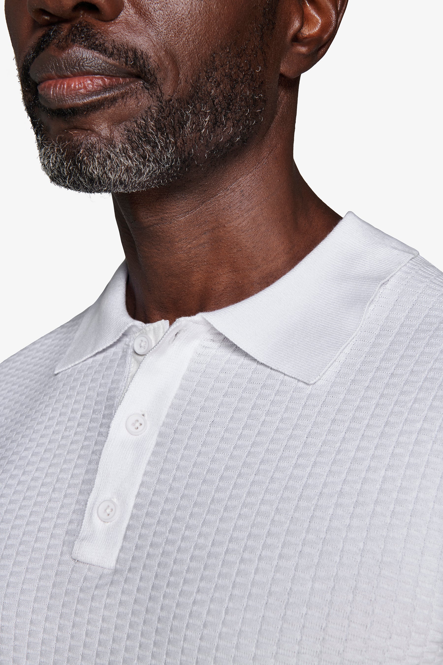 Polo in maglia punto dadino bianca