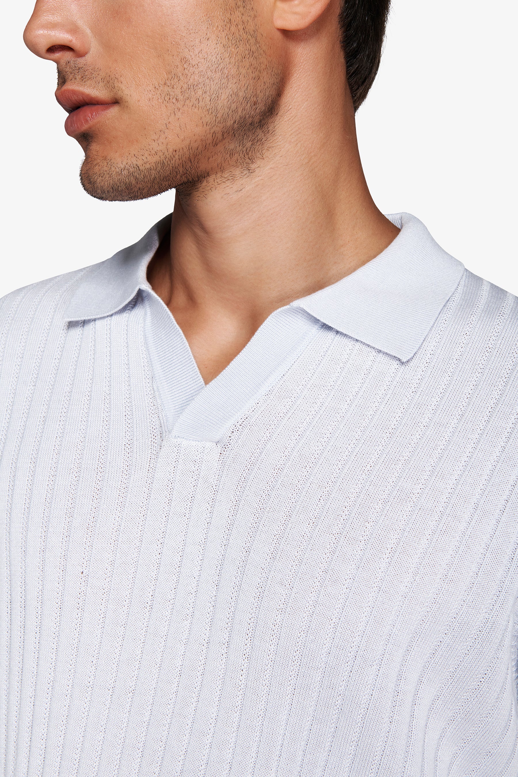 Polo in maglia collo aperto costa piatta celeste