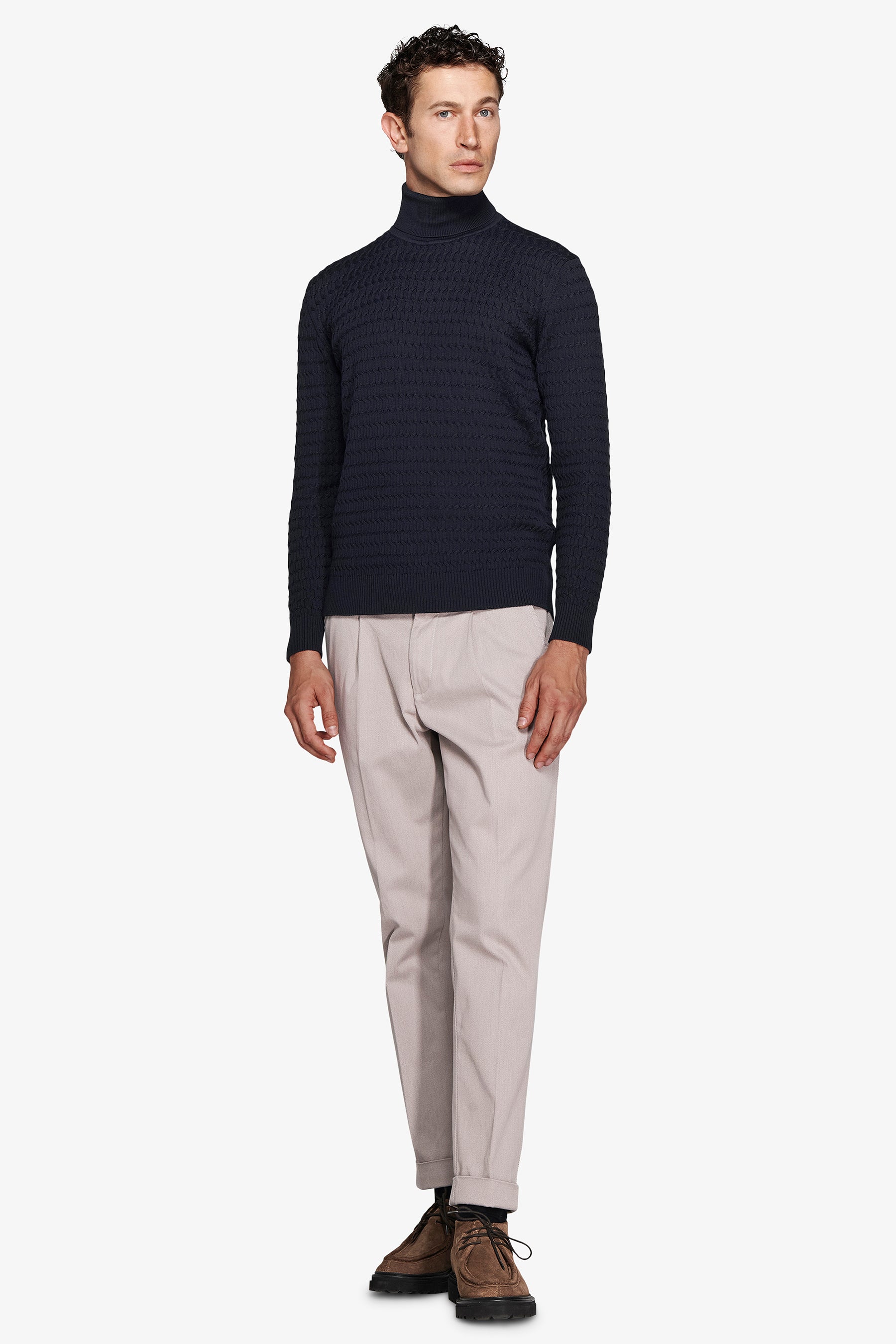 Blue cable knit turtleneck sweater