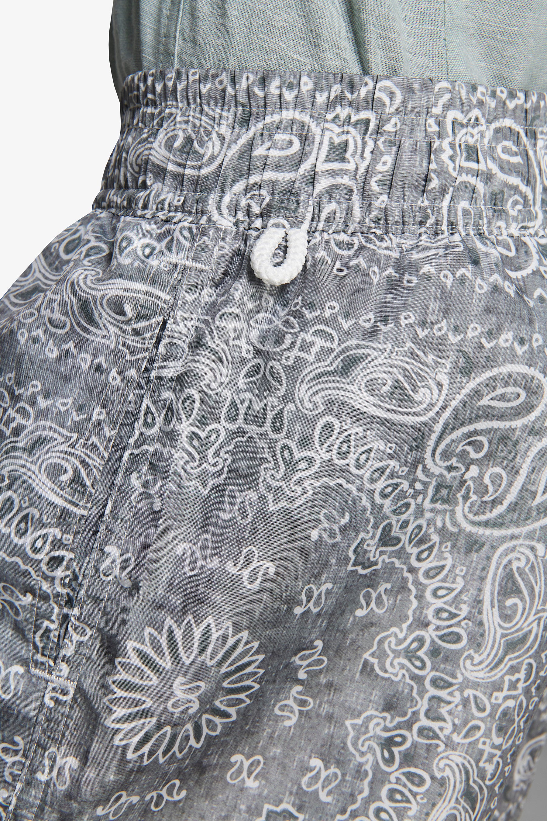 KIDS Sage floral print swim trunks
